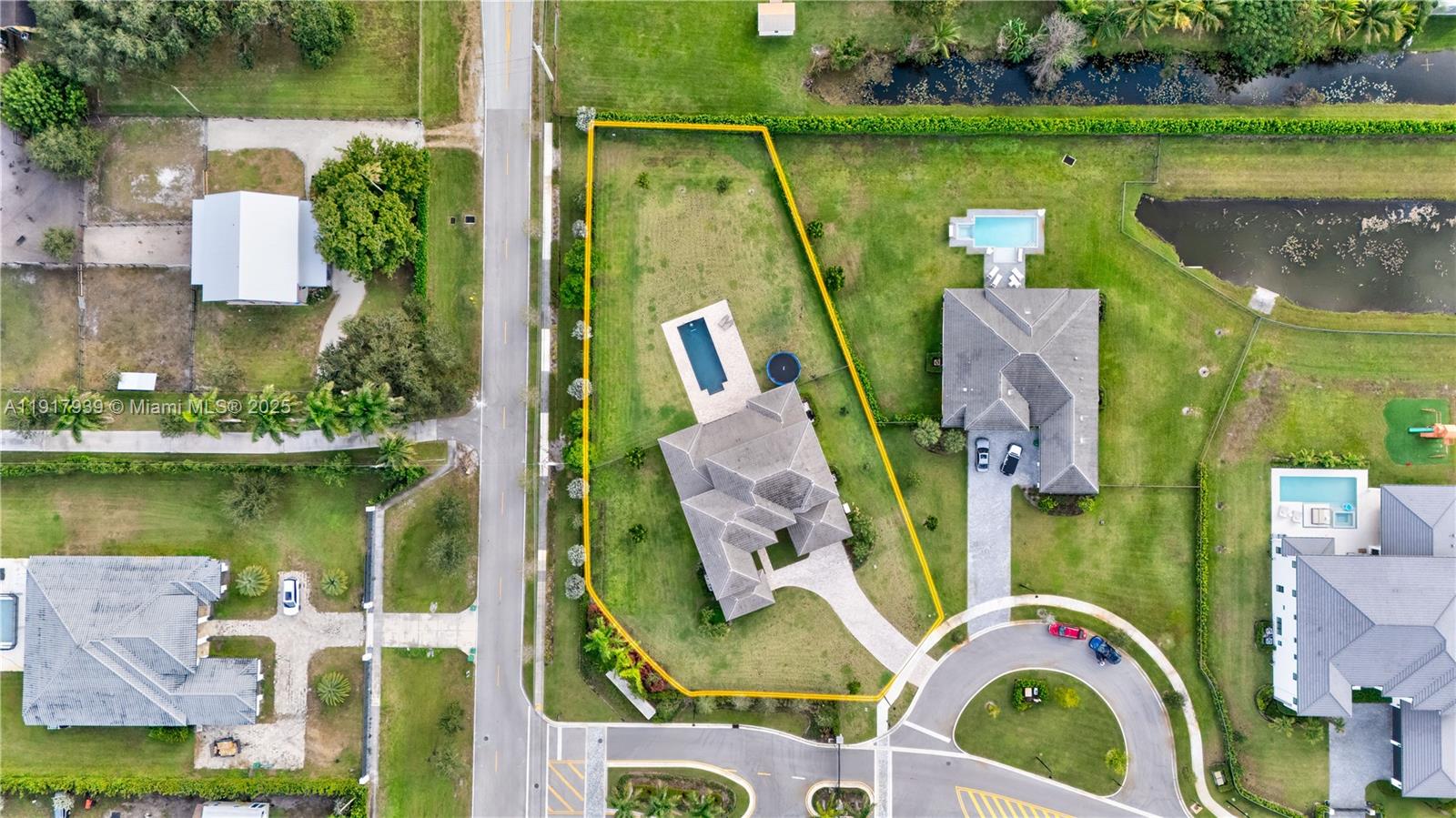 14820 Millstone Ranches Drive Davie, FL 33331 - Photo 57 of 60 an aerial view of a house with a lake view