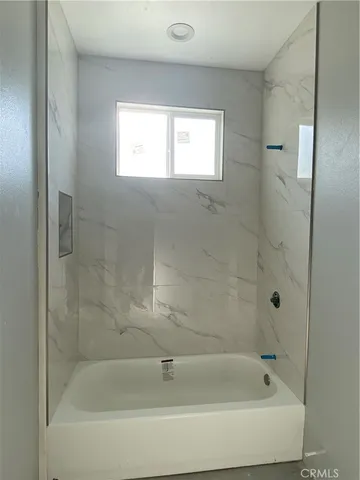 a close view of a bathtub in bathroom