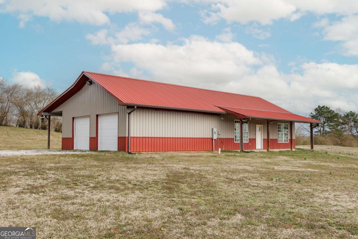 680 Berlin Road Homer, GA 30547 - Photo 1 of 1 a view of a house with a yard and garage