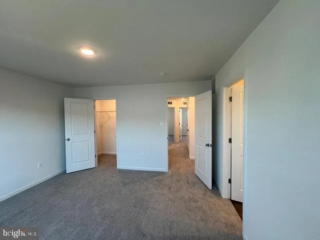 an empty room with closet area