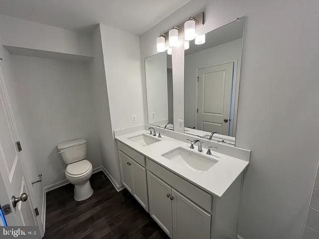 361 Truth Way Martinsburg, WV 25405 - Photo 2 of 17 a bathroom with a toilet sink and mirror