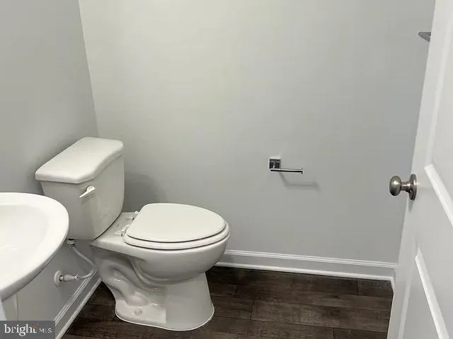 a bathroom with a toilet and a sink