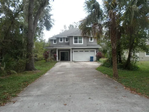 front view of a house with a garden