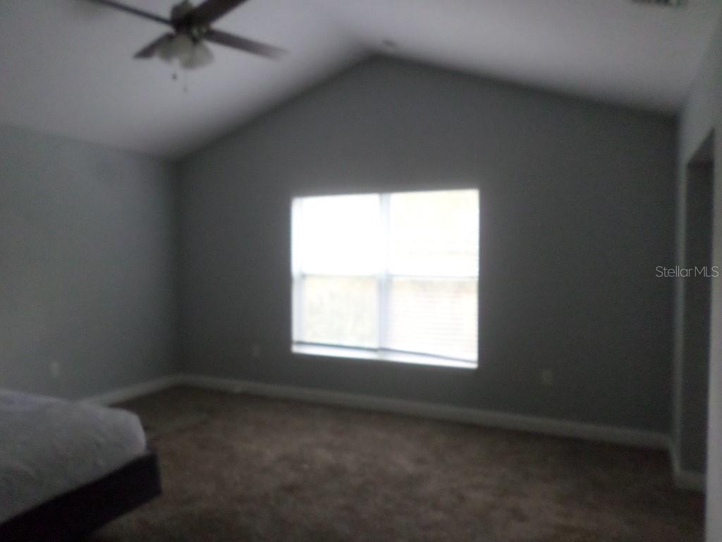 2773 Red Wing Village DeLand, FL 32720 - Photo 11 of 16 an empty room with a window