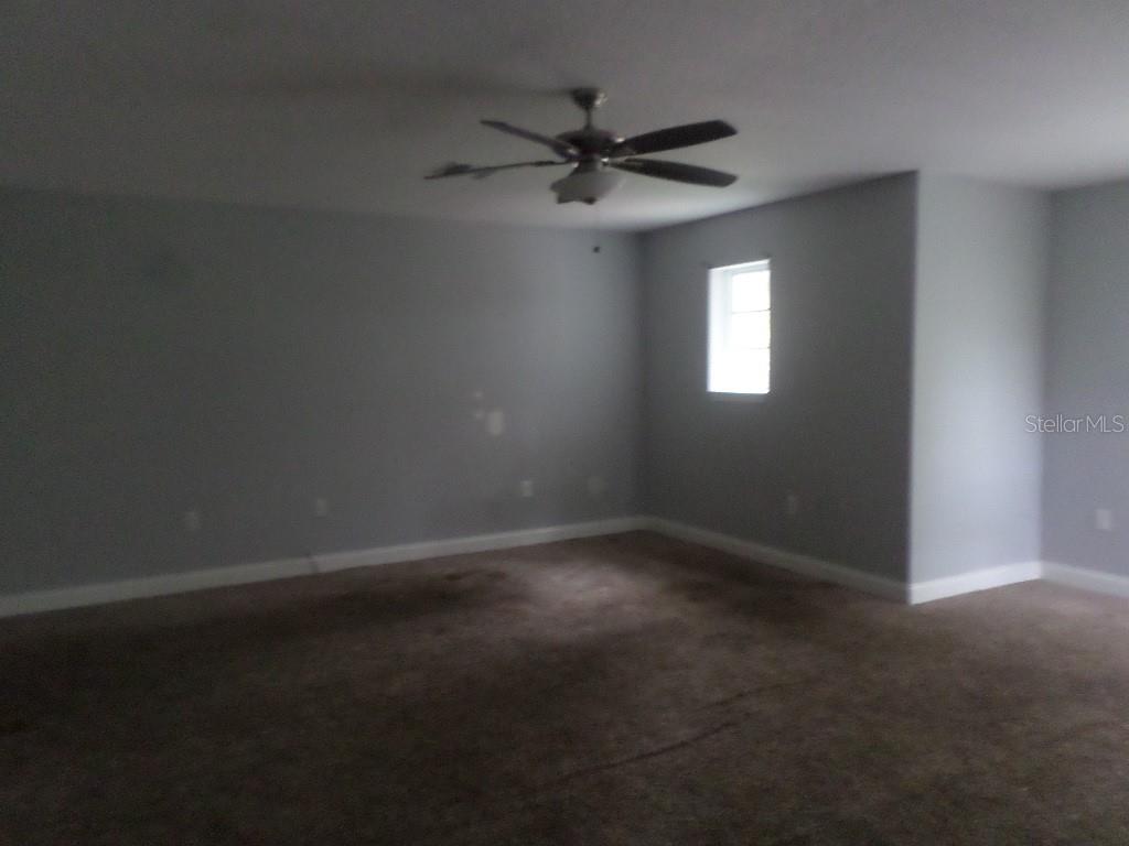 2773 Red Wing Village DeLand, FL 32720 - Photo 12 of 16 a view of an empty room with a window