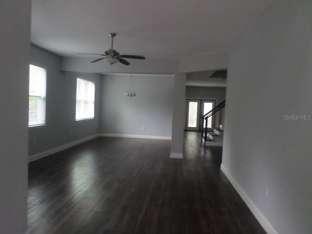 2773 Red Wing Village DeLand, FL 32720 - Photo 3 of 16 wooden floor in an empty room with a window