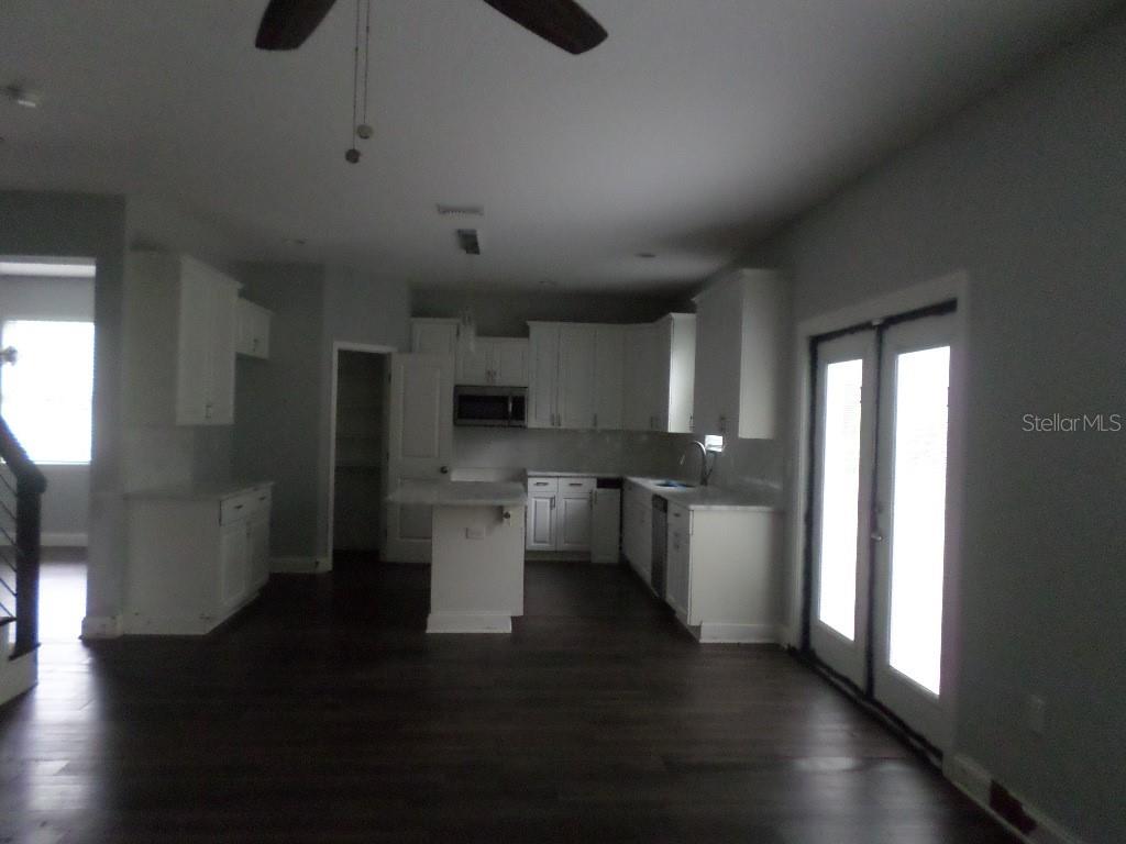 2773 Red Wing Village DeLand, FL 32720 - Photo 5 of 16 a kitchen with a sink and microwave