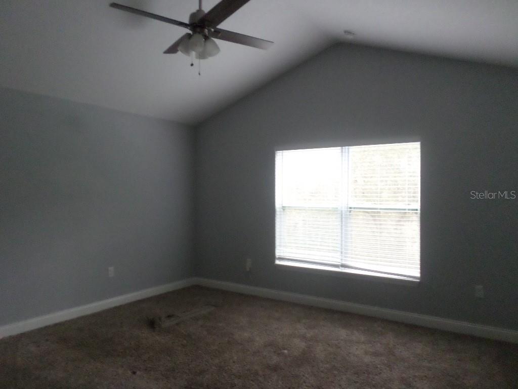 2773 Red Wing Village DeLand, FL 32720 - Photo 7 of 16 an empty room with a window