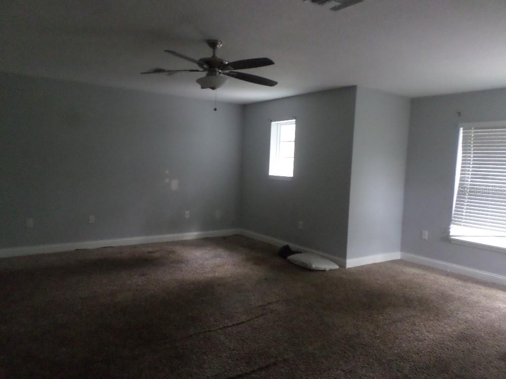 2773 Red Wing Village DeLand, FL 32720 - Photo 8 of 16 a view of an empty room and a window