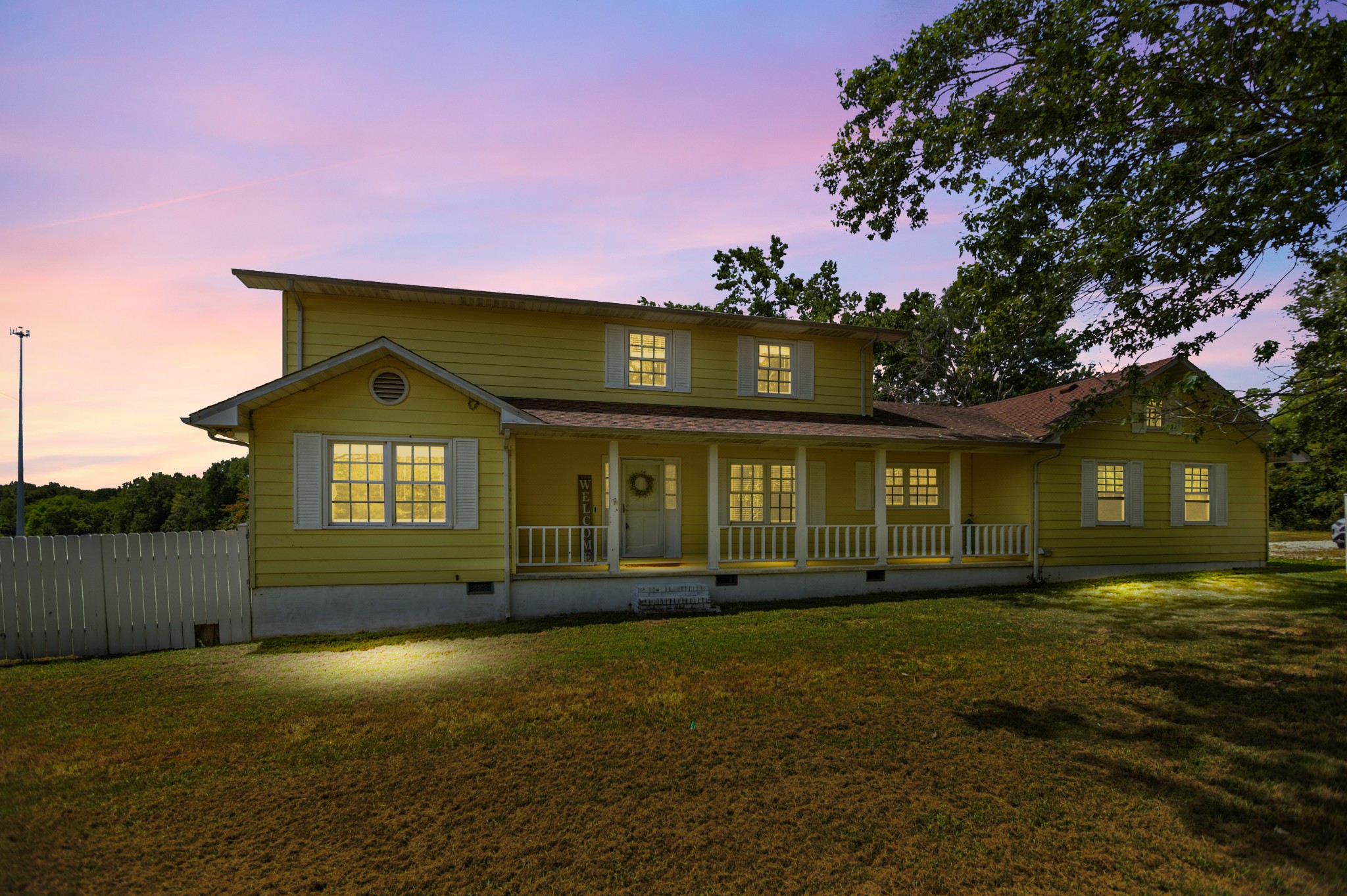 a front view of a house with a yard