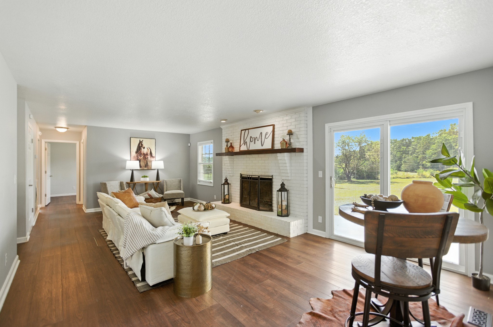 1840 Lockmiller Road Estill Springs, TN 37330 - Photo 25 of 71 a living room with fireplace furniture and a large window