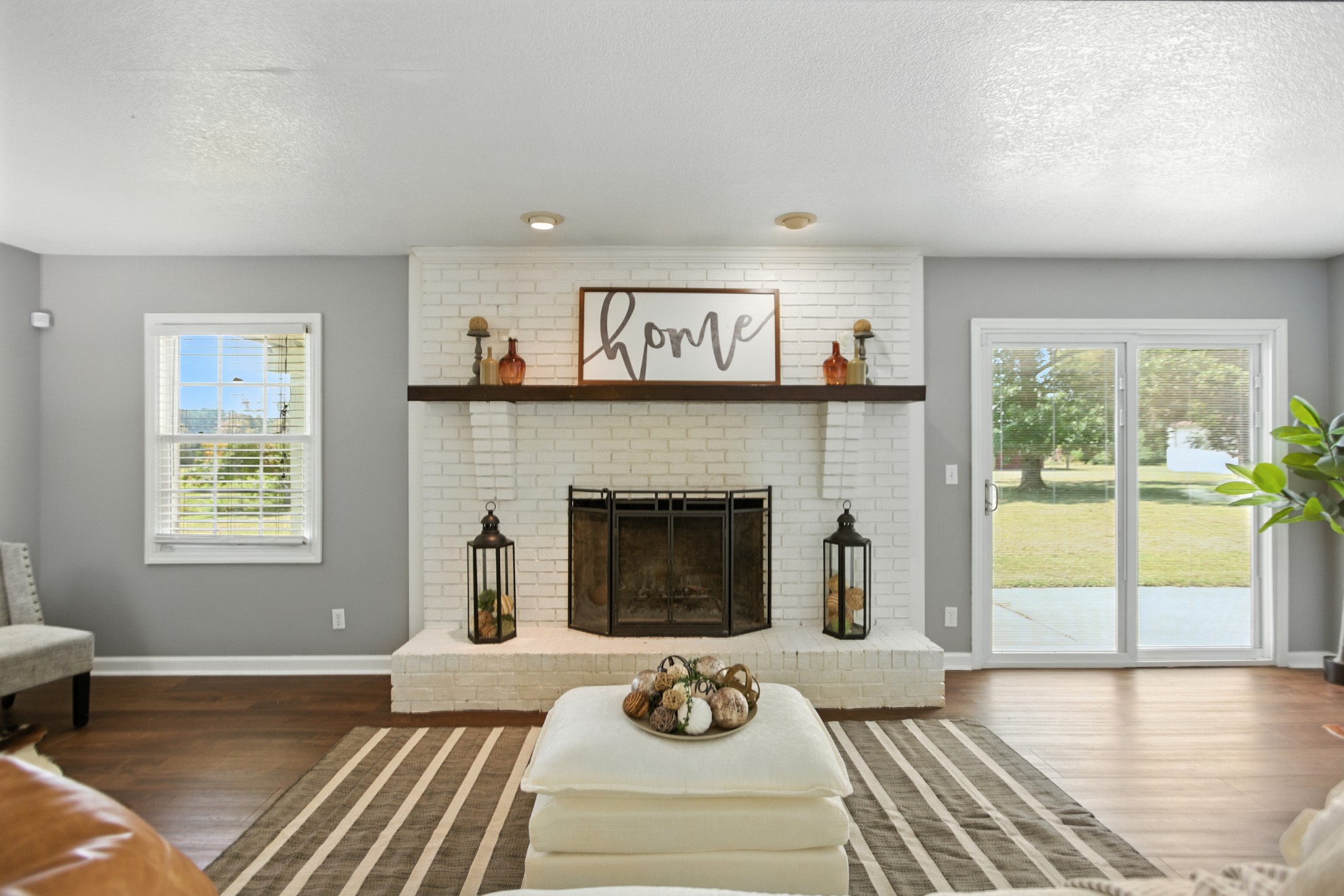 1840 Lockmiller Road Estill Springs, TN 37330 - Photo 26 of 71 a living room with furniture and a fireplace