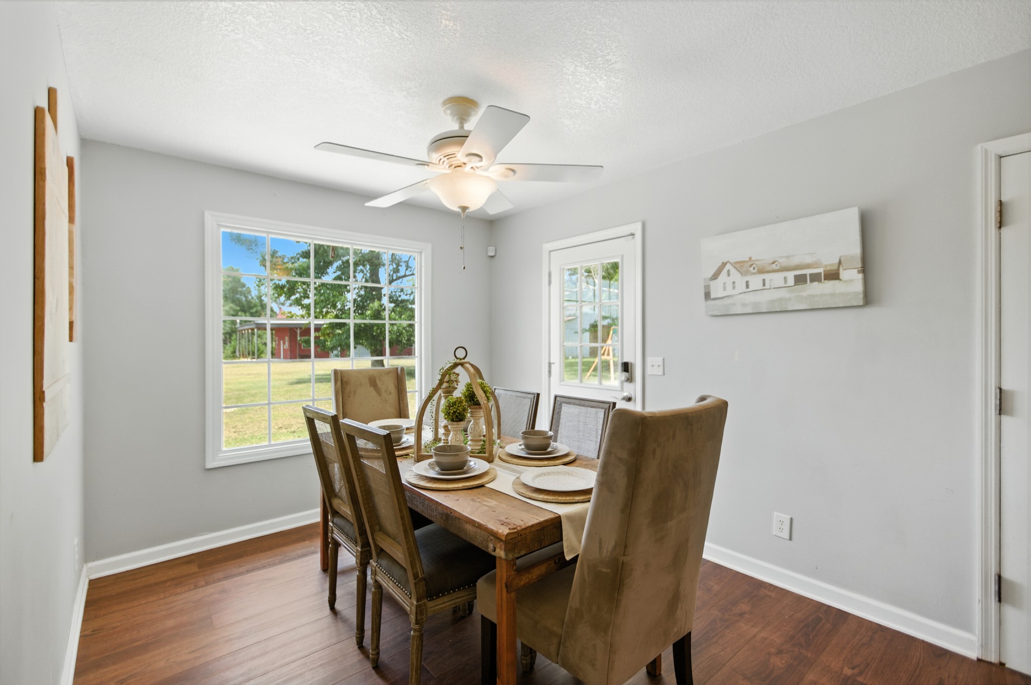1840 Lockmiller Road Estill Springs, TN 37330 - Photo 30 of 71 a dining room with furniture a window and wooden floor