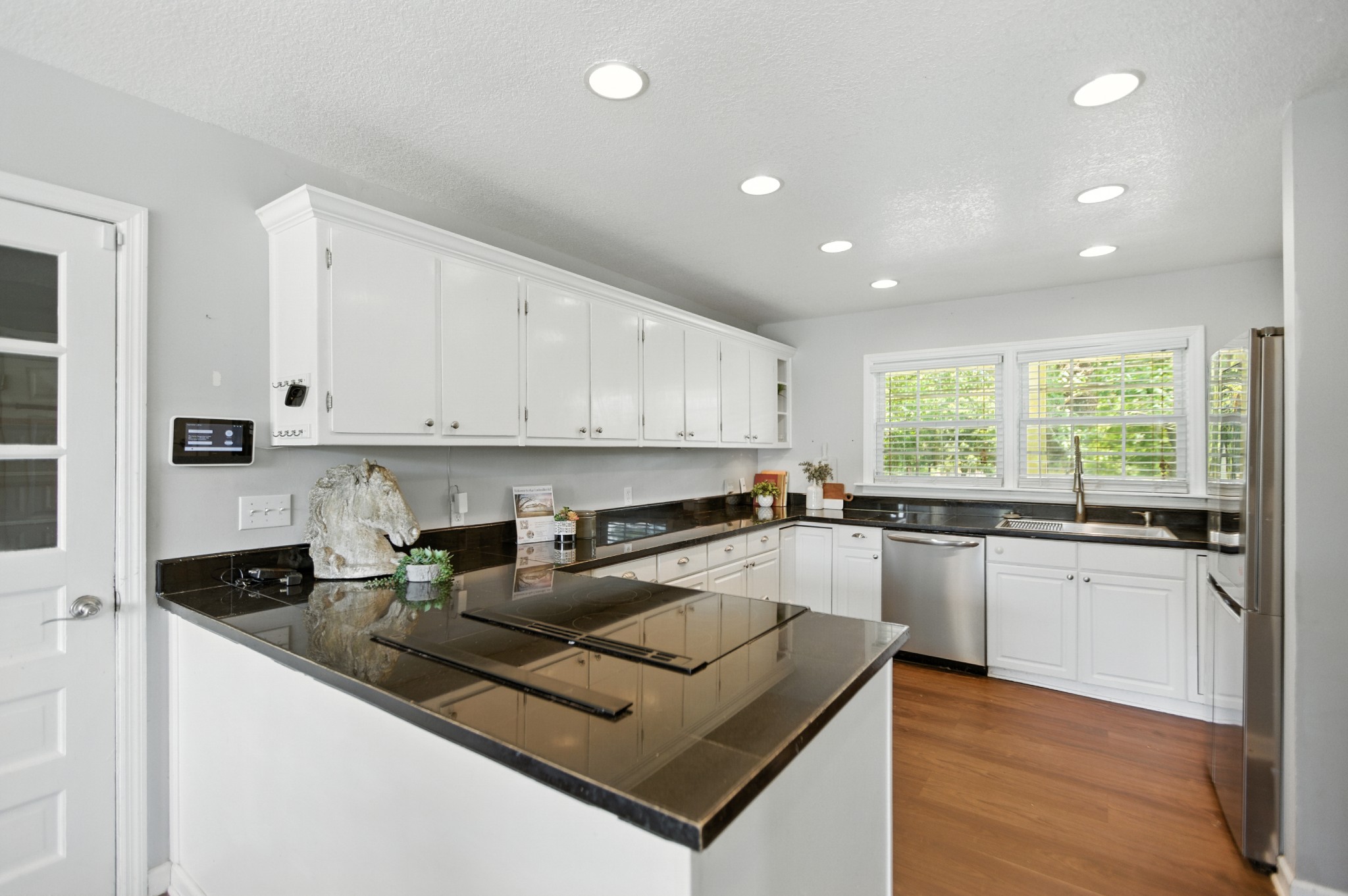 1840 Lockmiller Road Estill Springs, TN 37330 - Photo 31 of 71 a kitchen with granite countertop a stove sink and cabinets