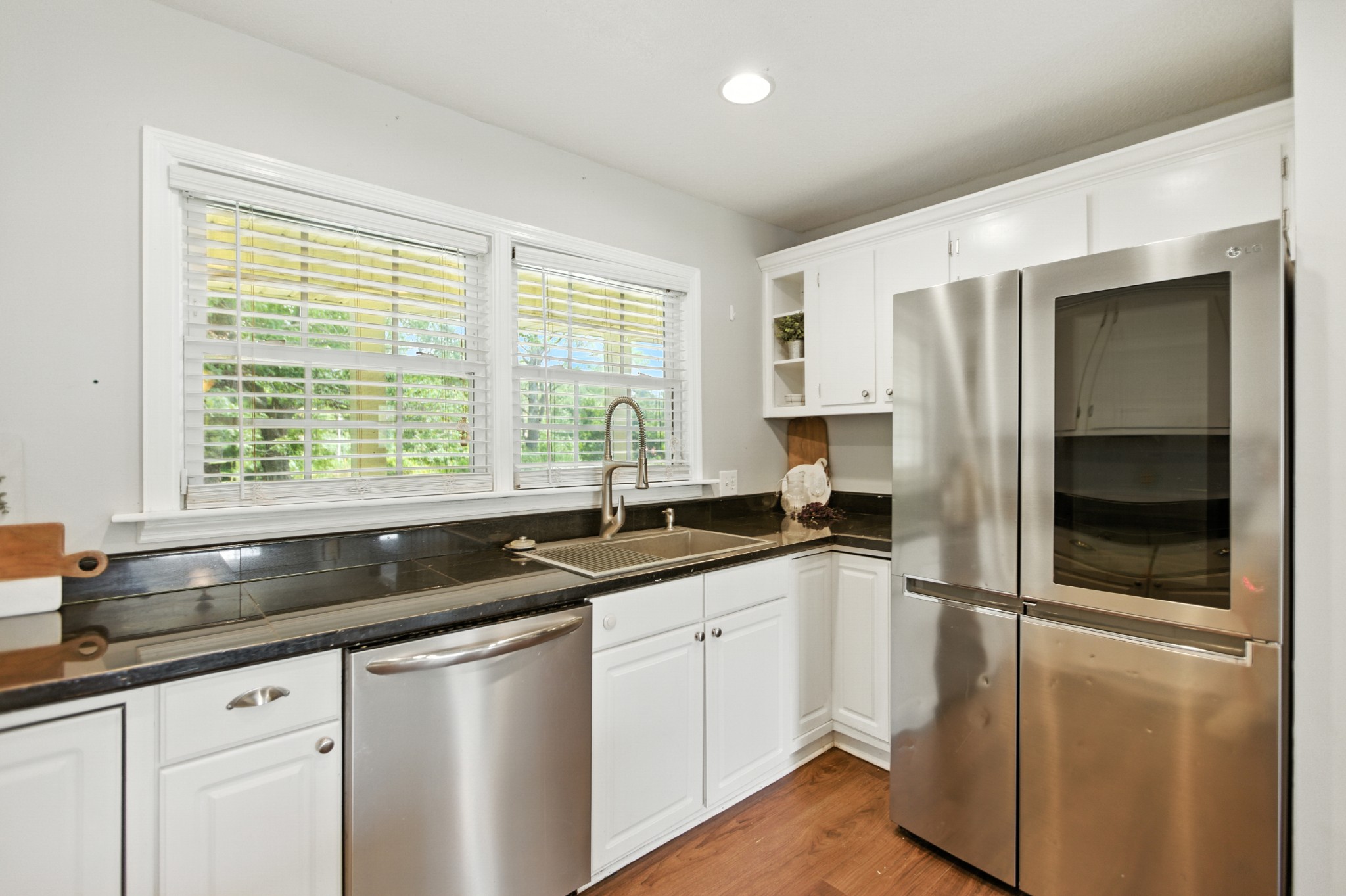 1840 Lockmiller Road Estill Springs, TN 37330 - Photo 33 of 71 a kitchen with granite countertop a sink and a refrigerator