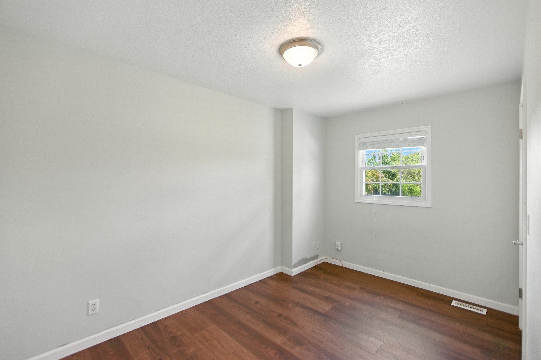 1840 Lockmiller Road Estill Springs, TN 37330 - Photo 42 of 71 an empty room with wooden floor and windows