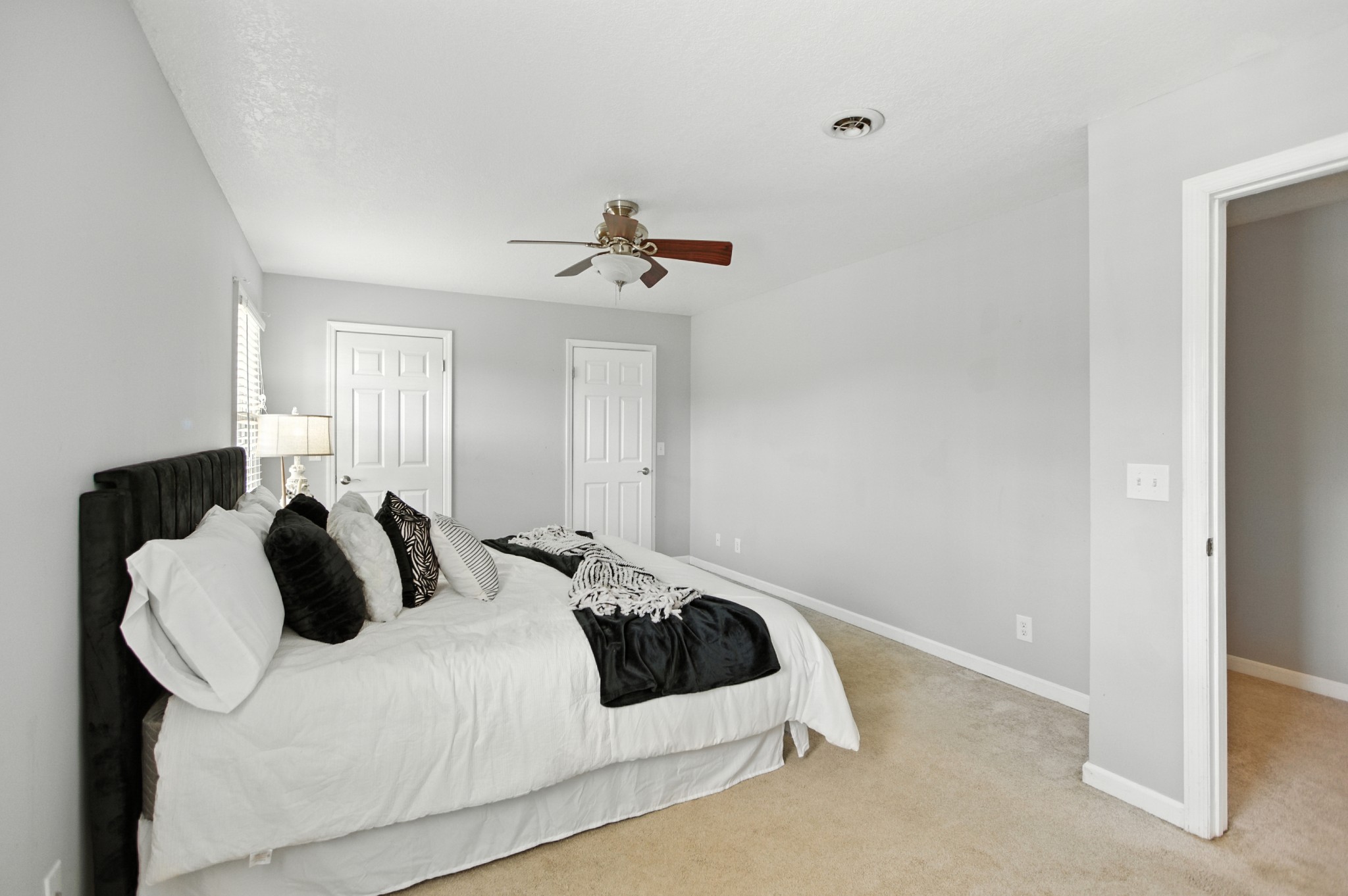 1840 Lockmiller Road Estill Springs, TN 37330 - Photo 45 of 71 a bedroom with a bed and a lamp