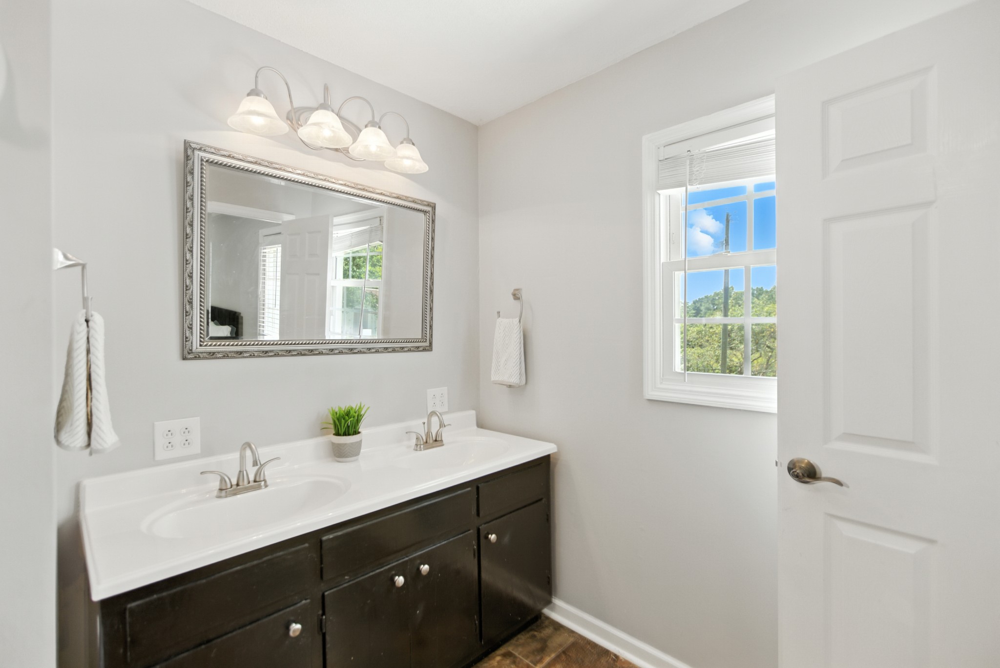 1840 Lockmiller Road Estill Springs, TN 37330 - Photo 48 of 71 a bathroom with a double vanity sink and a mirror