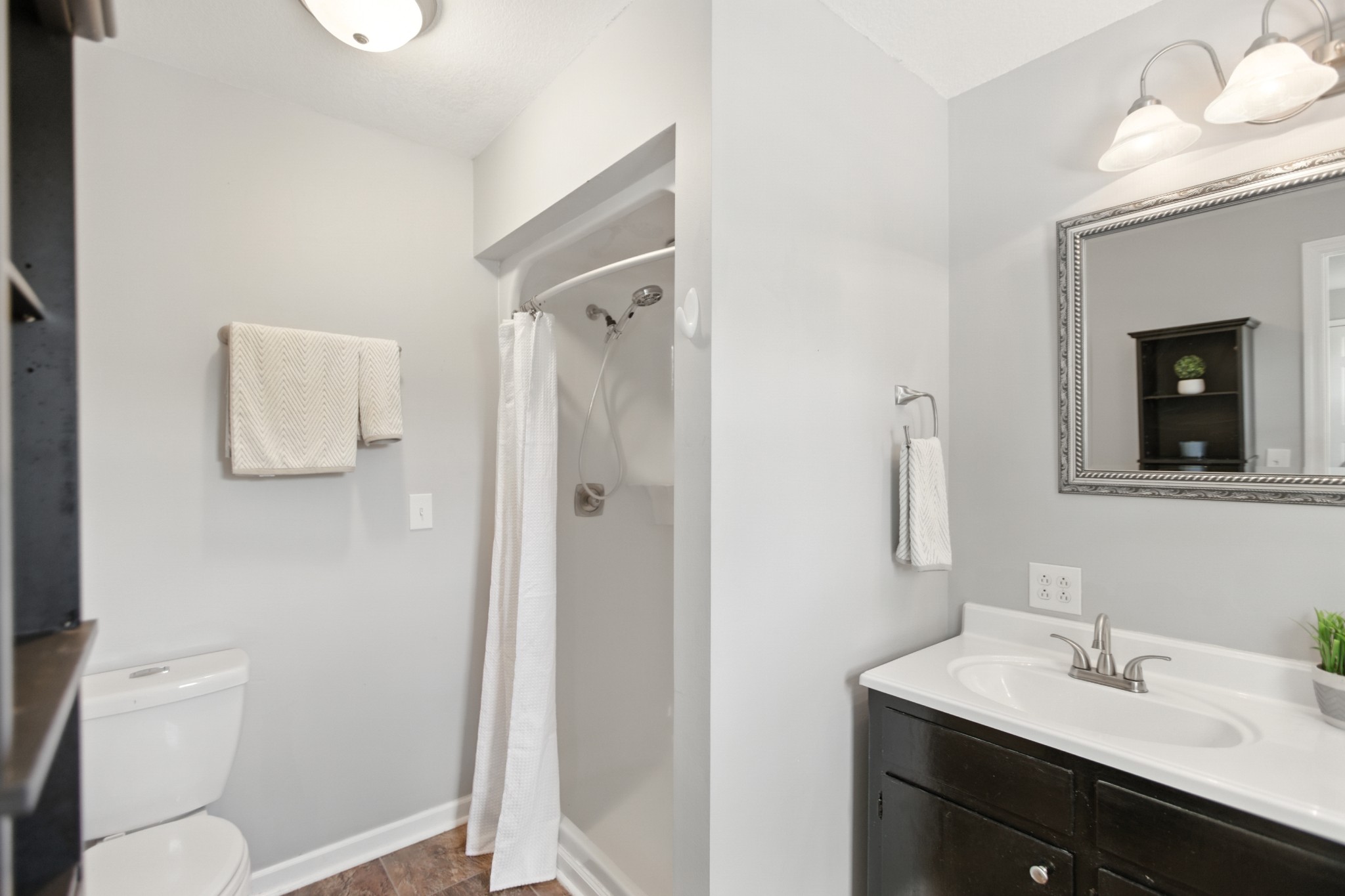 1840 Lockmiller Road Estill Springs, TN 37330 - Photo 50 of 71 a bathroom with a sink a toilet and shower