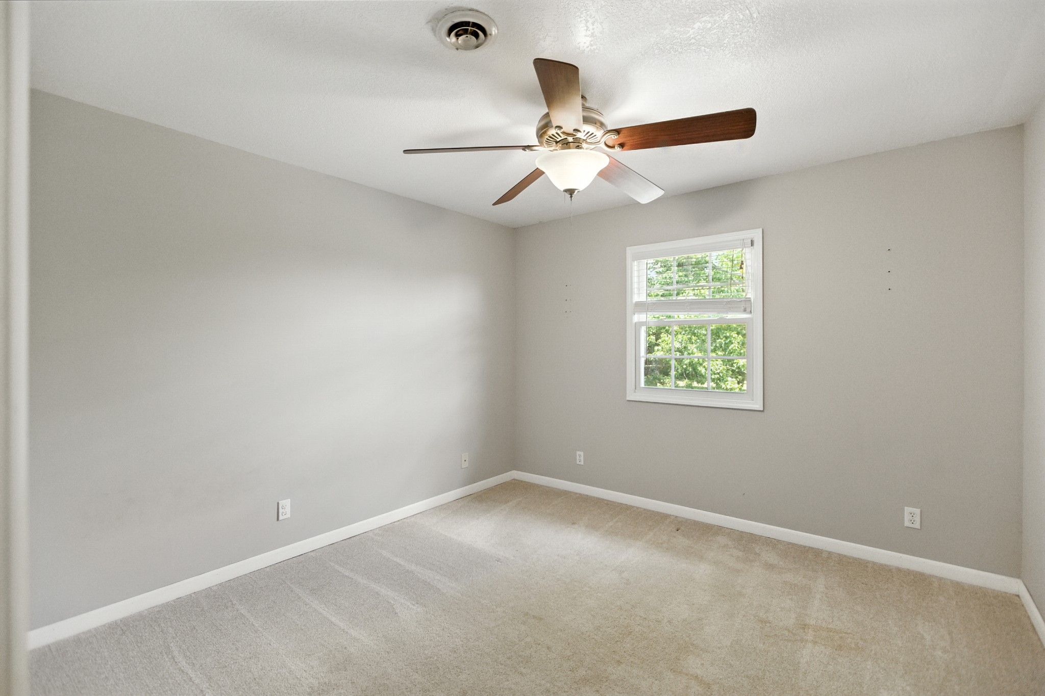 1840 Lockmiller Road Estill Springs, TN 37330 - Photo 60 of 71 an empty room with a window and a fan