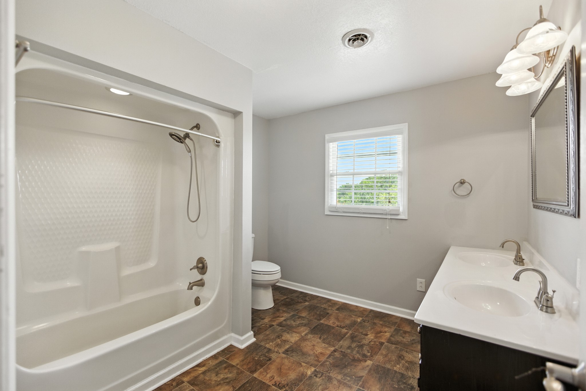 1840 Lockmiller Road Estill Springs, TN 37330 - Photo 63 of 71 a bathroom with a sink a toilet and shower