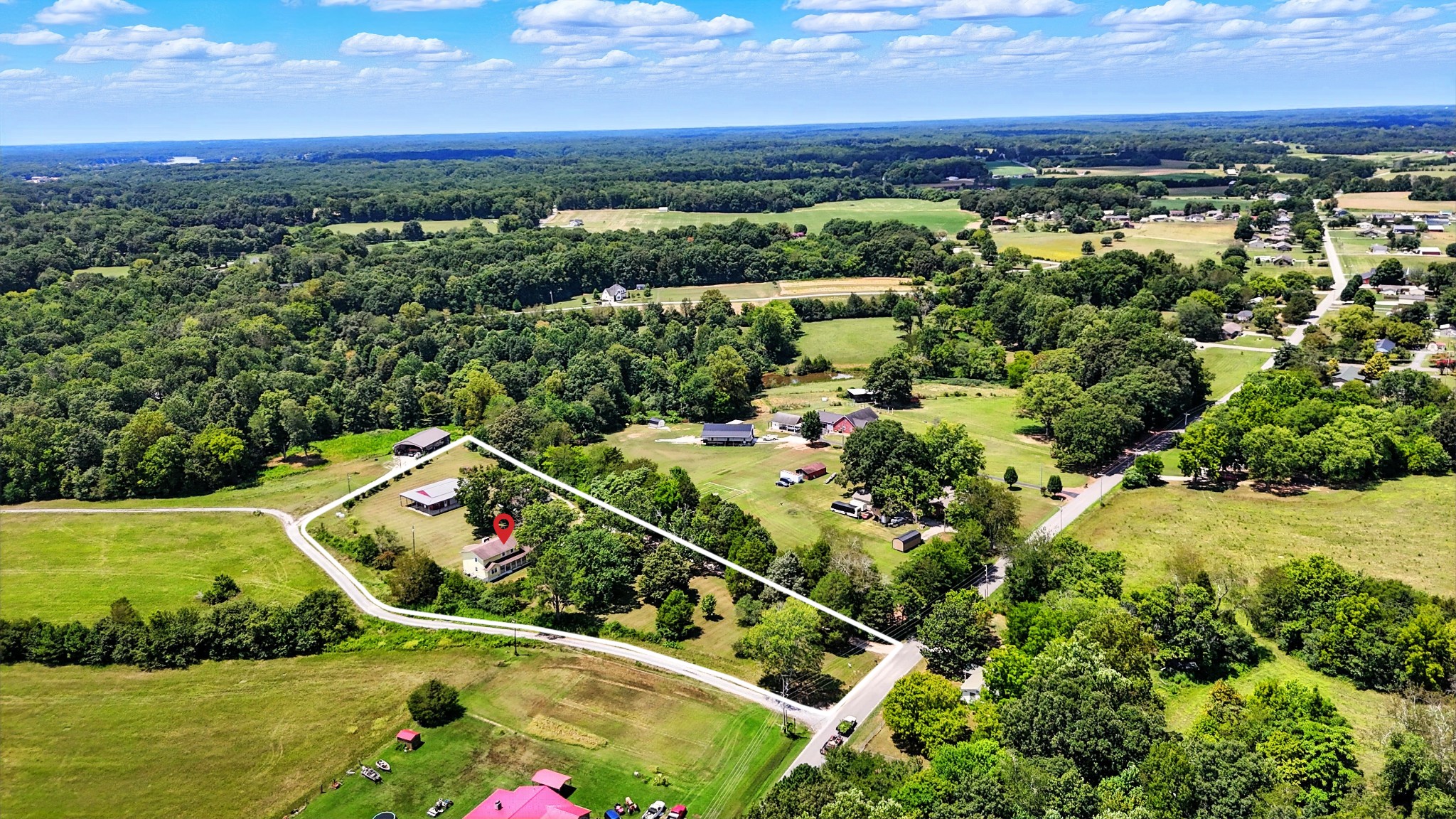 1840 Lockmiller Road Estill Springs, TN 37330 - Photo 9 of 71 an aerial view of a city with lots of residential buildings ocean and mountain view in back