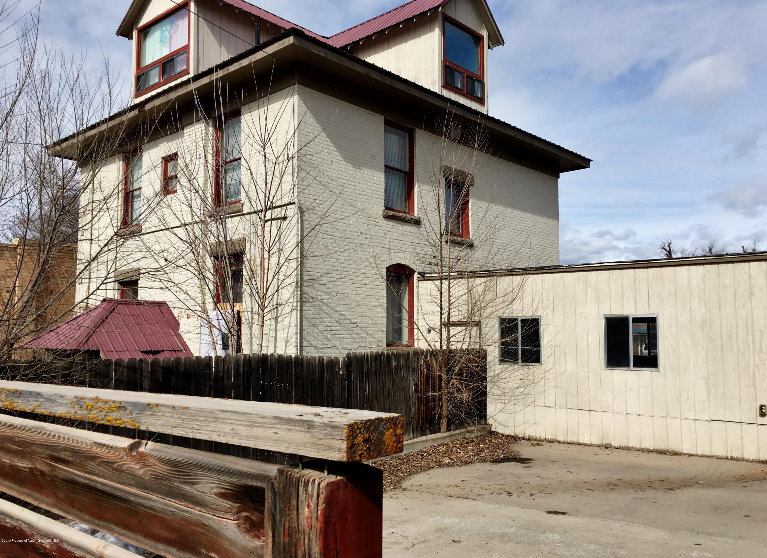 241 East 3rd Street Rifle, CO 81650 - Photo 1 of 22 a view of a house with a wooden fence