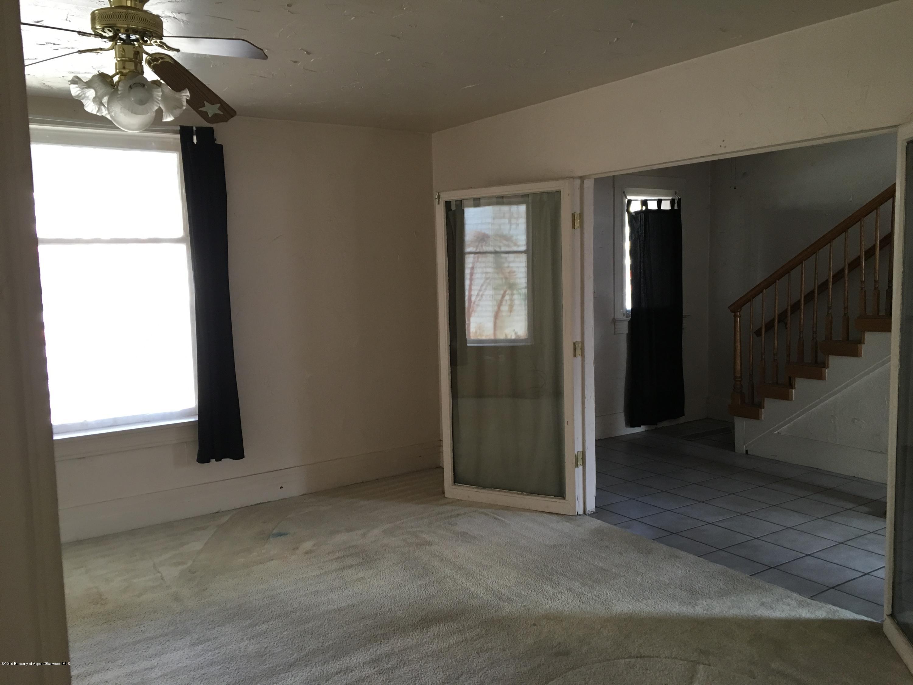 241 East 3rd Street Rifle, CO 81650 - Photo 8 of 22 a view of empty room with window