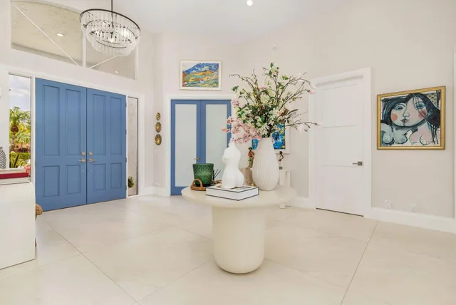 a view of a hallway with paintings on the wall
