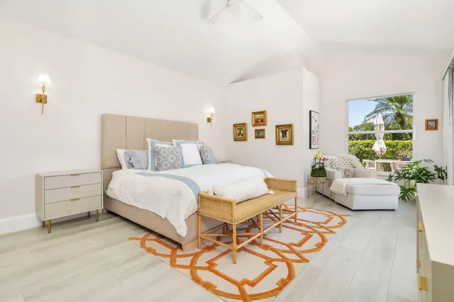 a bathroom with a double vanity sink mirror and a bathtub