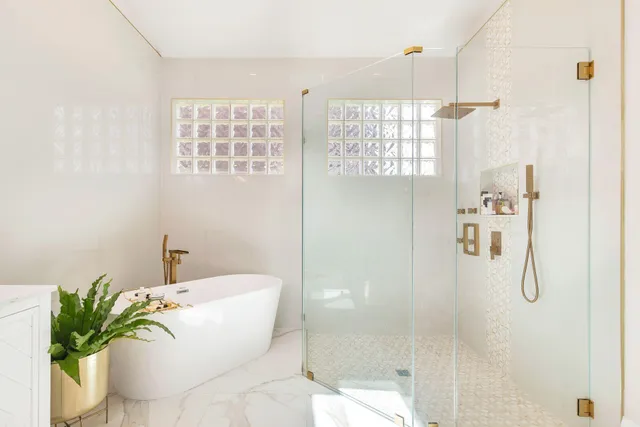 a bedroom with two beds and a window