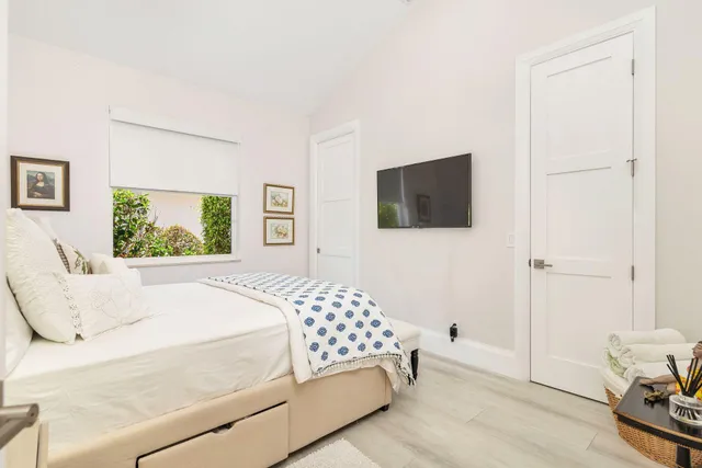 a living room with furniture and flowers