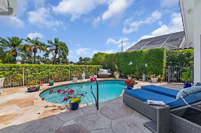 a view of a house with a backyard porch and sitting area