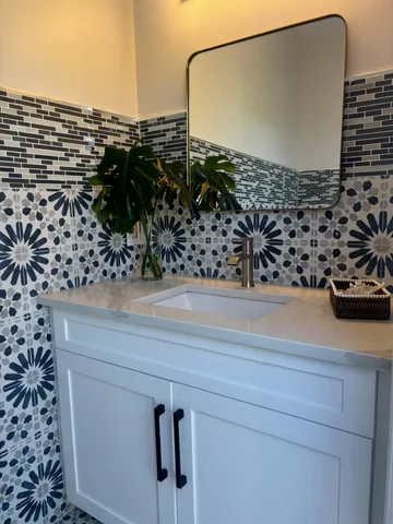 an aerial view of a house with garden space and street view