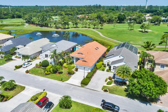 an aerial view of residential houses with outdoor space and river