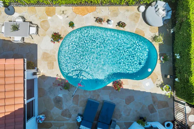 a view of swimming pool with outdoor seating