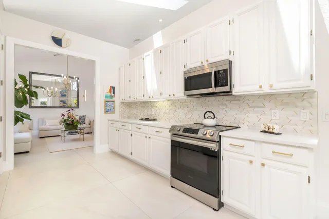 view of living room with furniture and refrigerator
