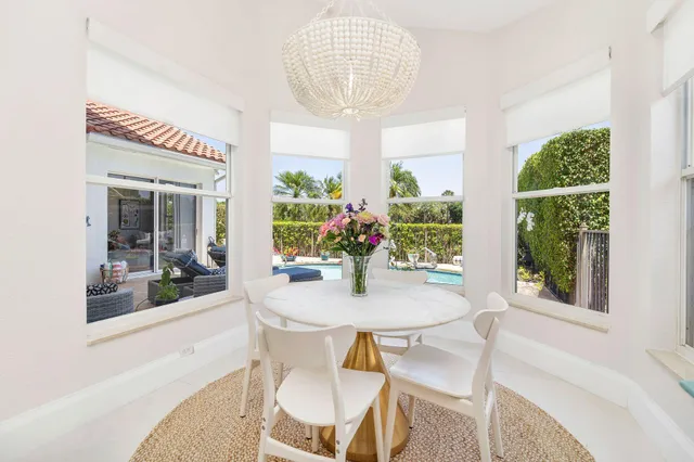 a bedroom with a flat screen tv on dresser and a flat screen tv