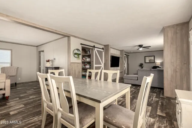 a kitchen with kitchen island a counter top space a refrigerator a sink and a stove