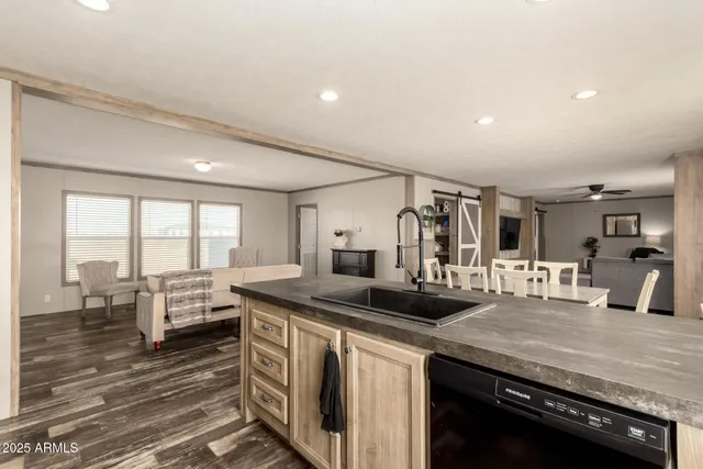 a kitchen with a stove and white cabinets