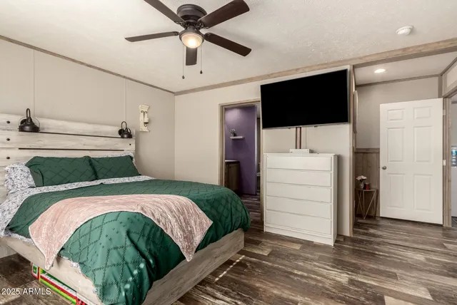 a bedroom with a bed and a dresser