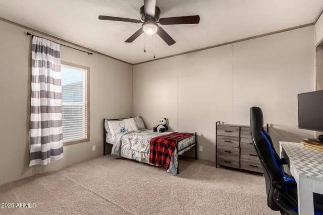 a bedroom with a workspace