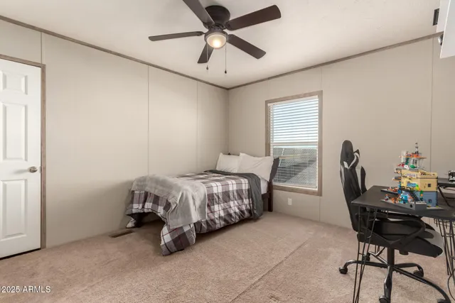 a bedroom with a bed and a dresser