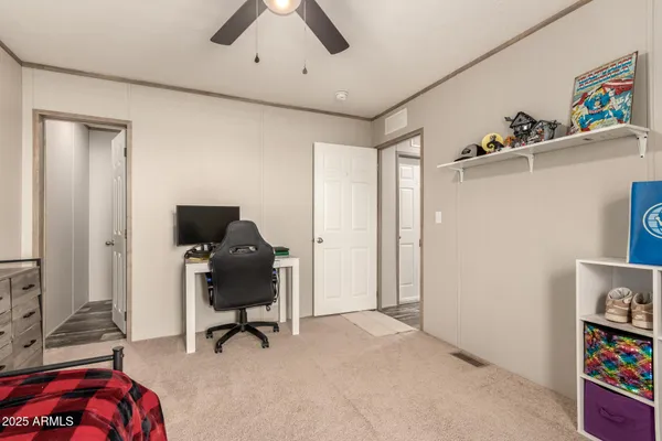 a bedroom with a bed and a desk