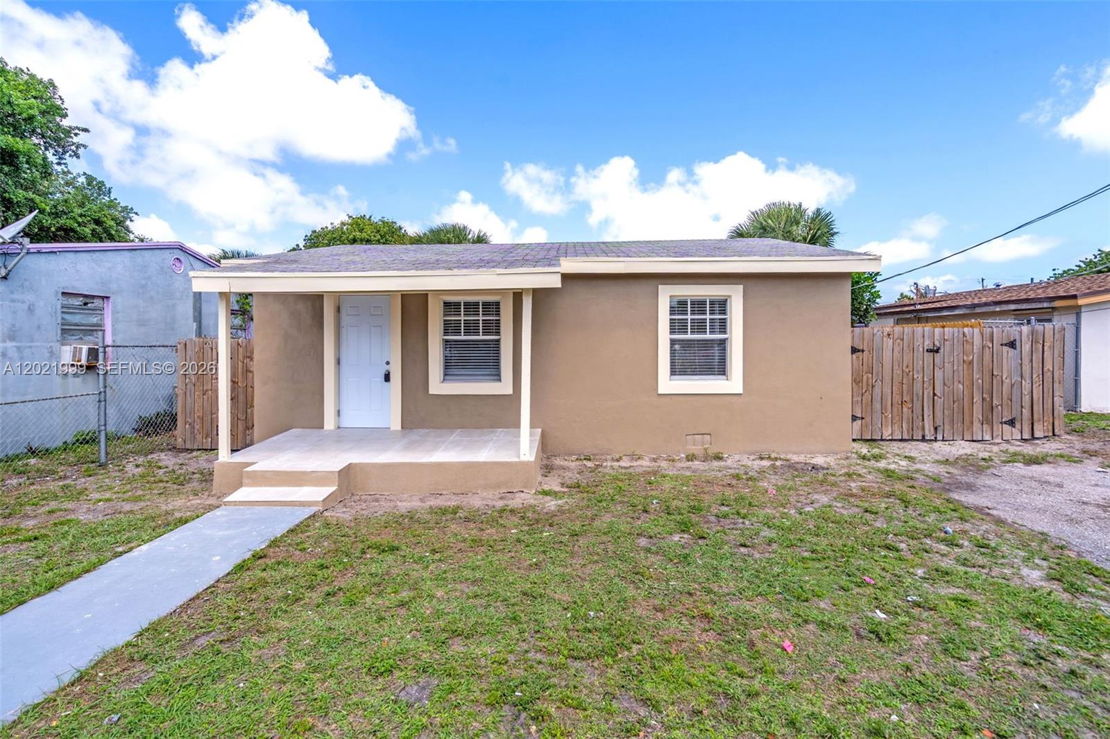 1660 West 26th Street Riviera Beach, FL 33404 - Photo 2 of 28 a view of a backyard of the house