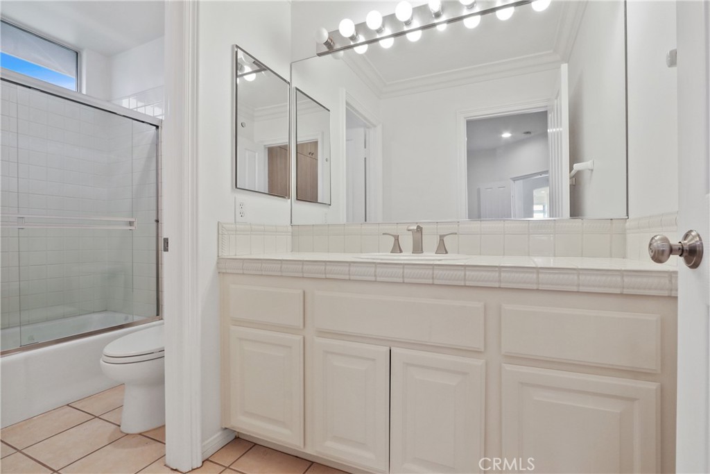 34152 Cambridge Road Dana Point, CA 92629 - Photo 13 of 25 a bathroom with a toilet a sink and mirror
