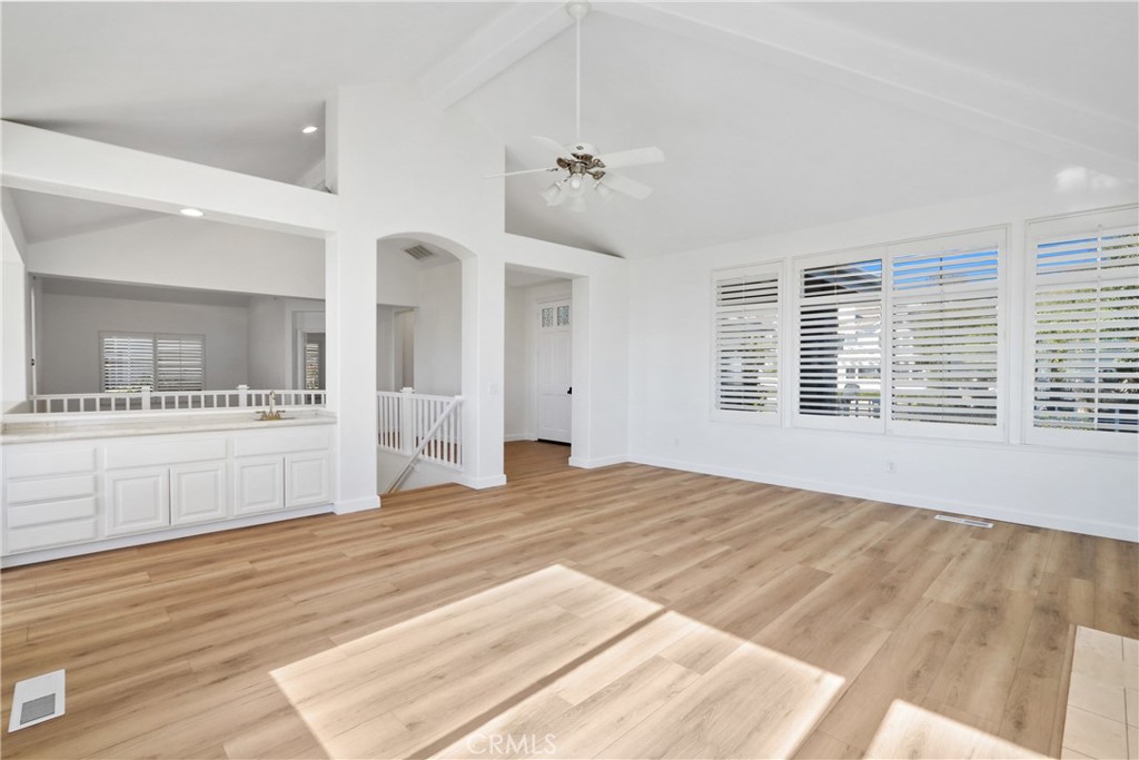 34152 Cambridge Road Dana Point, CA 92629 - Photo 4 of 25 a view of a bedroom with wooden floor