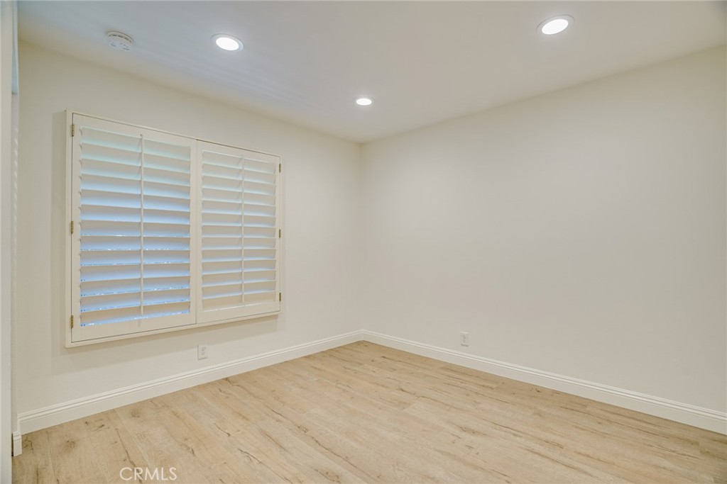 49 East Yale Loop, Unit 26 Irvine, CA 92604 - Photo 28 of 63 a view of empty room with wooden floor and fan