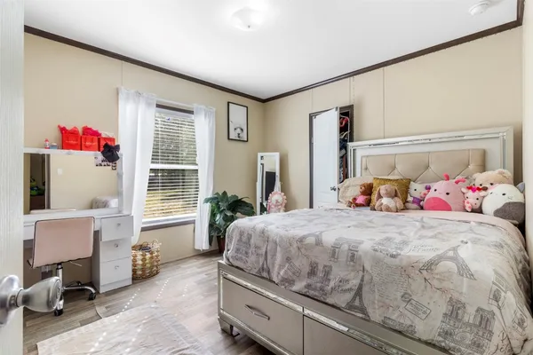 a bedroom with bed and window