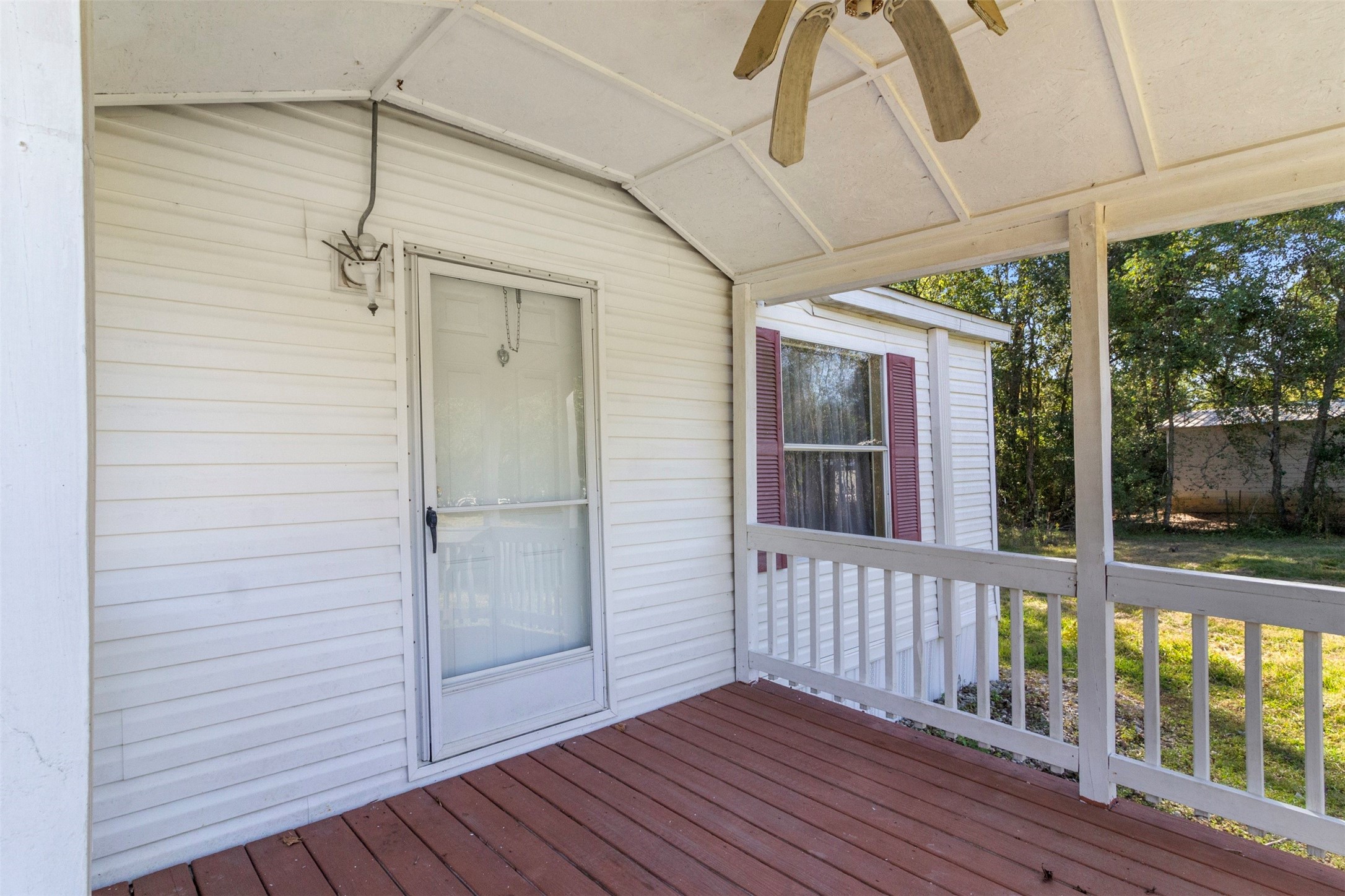 27182 East River Road Splendora, TX 77372 - Photo 19 of 40 a view of a porch with wooden floor and outdoor space